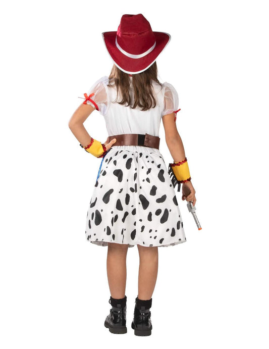 Tyttöjen cowgirl-pukupukon sarjakuvatyylinen takanäkymä