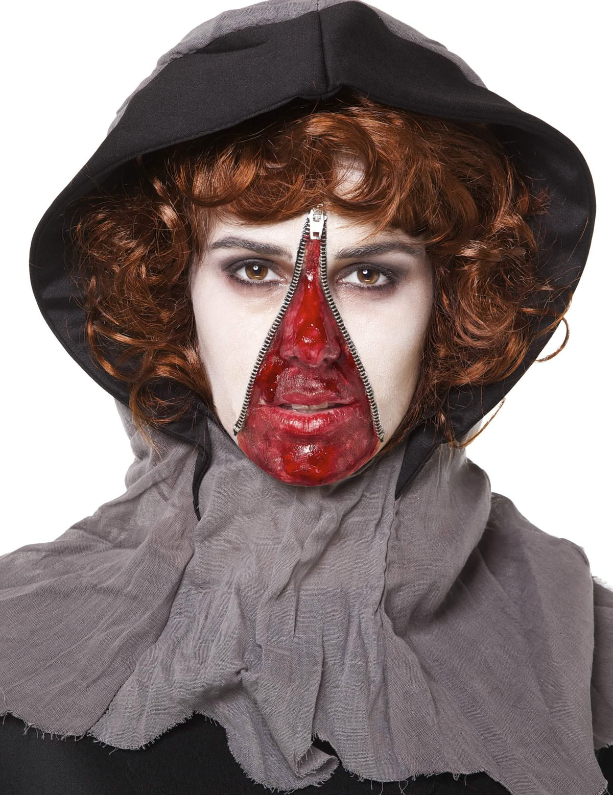 Valmiin halloween-meikkisettipakkauksen edestä nähty kuva, jossa on vetoketju