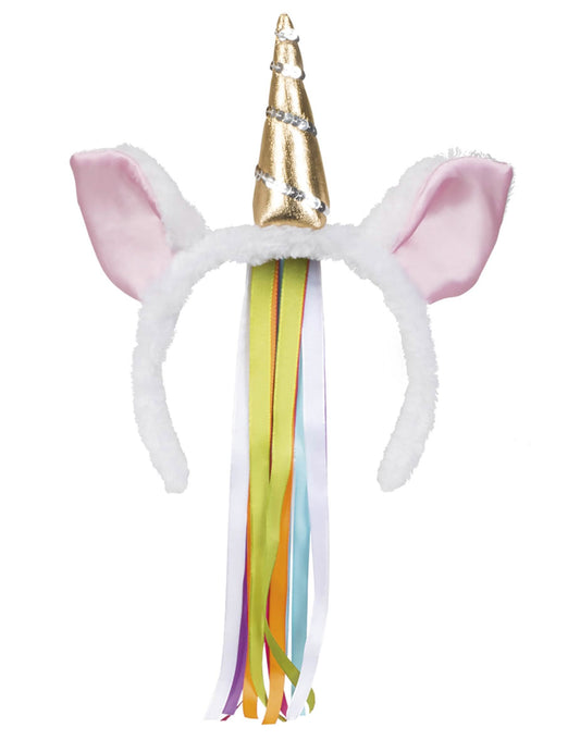 Détail de la corne dorée et des rubans flashy du serre-tête licorne