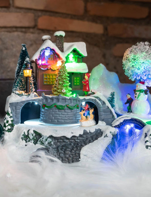 Vue de face du village de noël lumineux maison