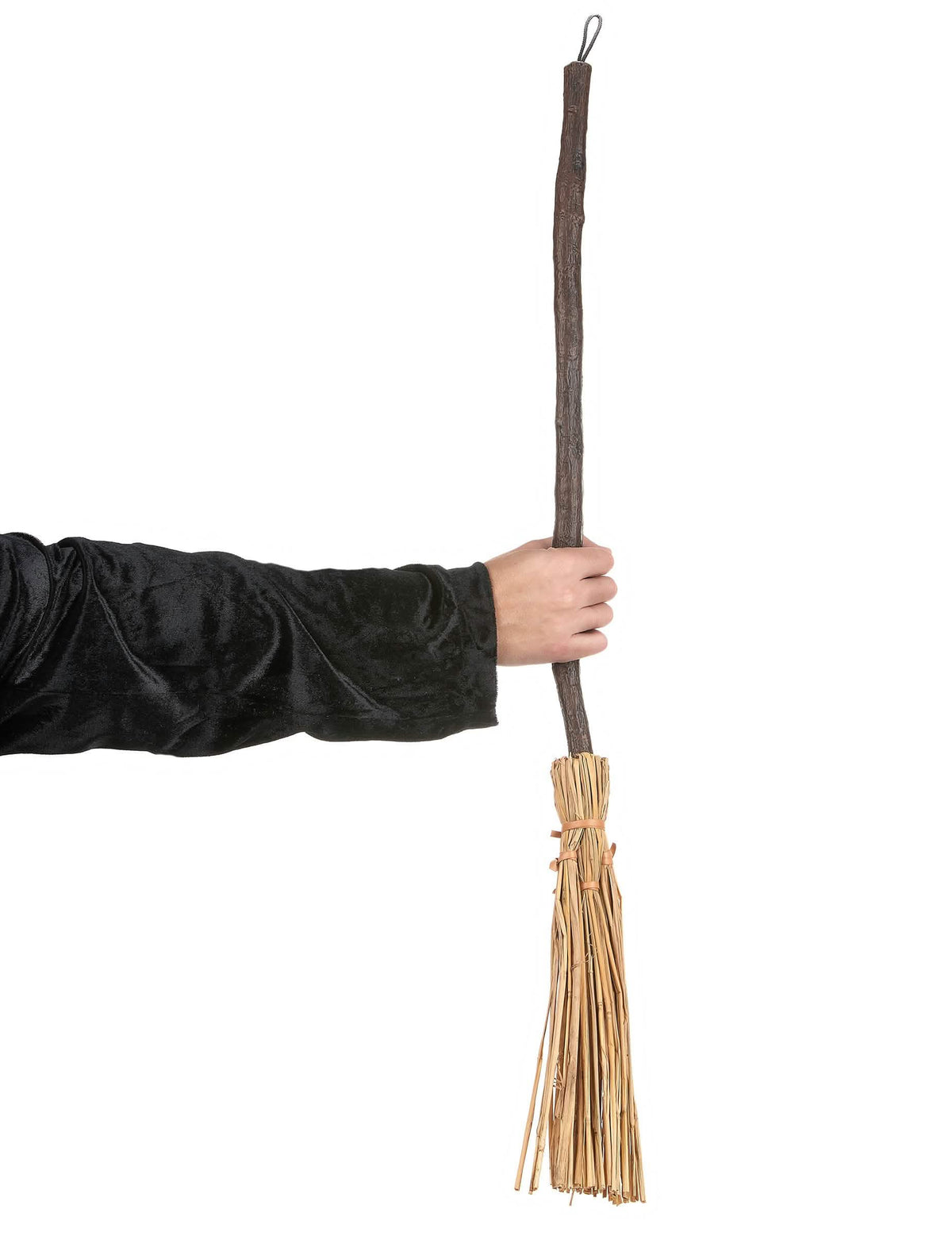 Mise en situation du balai de sorcière tenu par une main