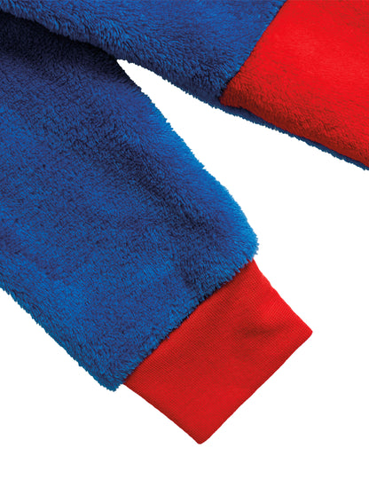 Détail du tissu polaire et du poignet de la combinaison Superman pour enfant