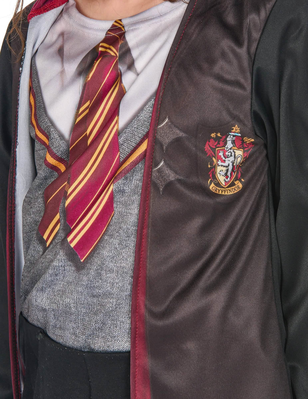 Rohkelikonin vaakunan yksityiskohta asusteet sisältävässä Harry Potter™ -asutuksessa käytettävässä mekossa