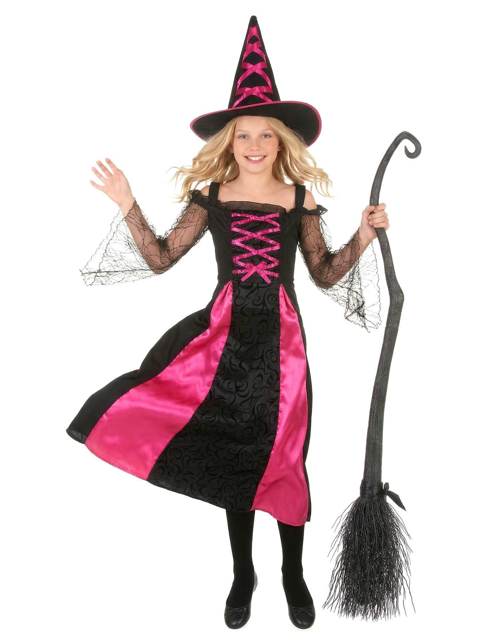 Edestä kuvattuna, luuta kädessä, sahalaitainen halloween-noidan asu