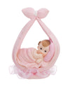 Figurine petite fille dans une écharpe pour baptême rose