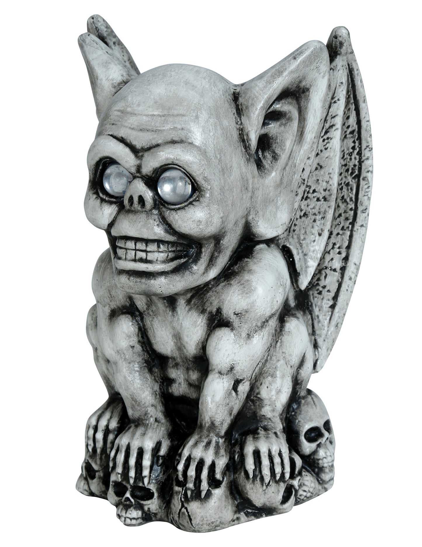 Gargouille décorative pour Halloween grise effet pierre avec yeux clairs sur socle de crânes