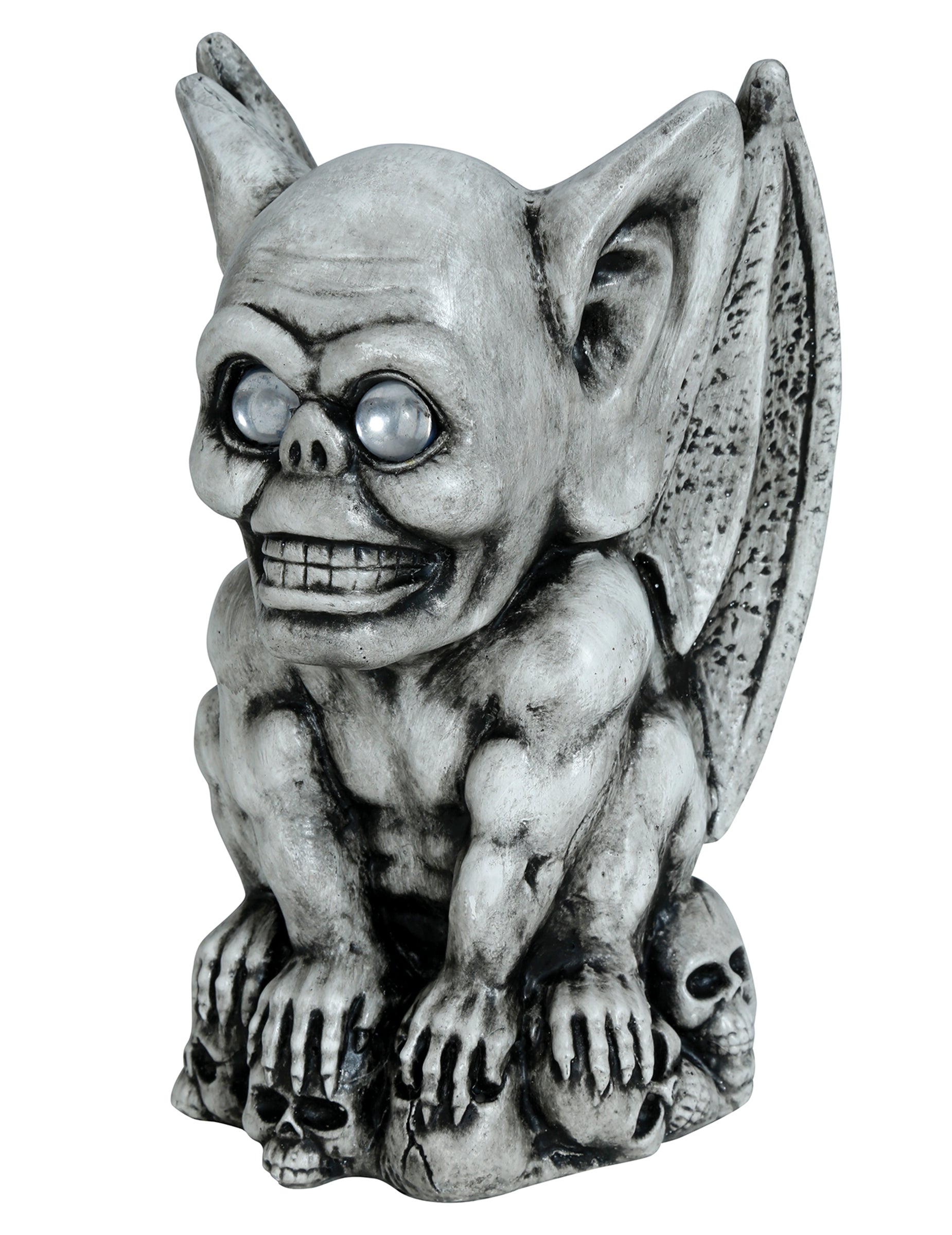 Gargouille décorative pour Halloween grise effet pierre avec yeux clairs sur socle de crânes