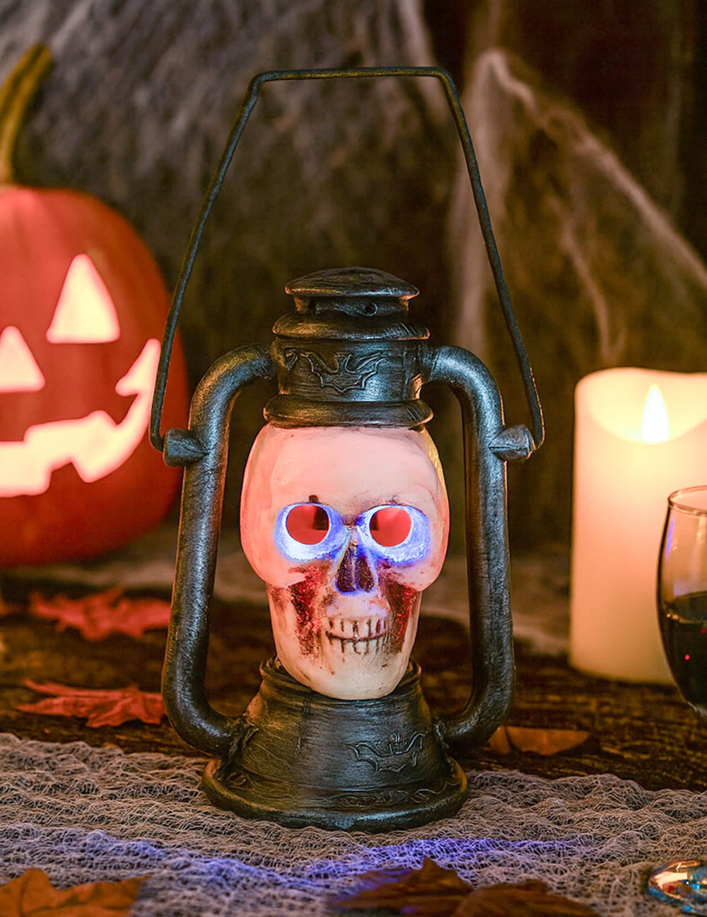 Lanterne Crâne effrayante pour Halloween lumineuse noire aux yeux bleus